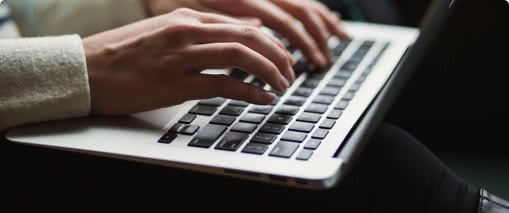 Person typing on a laptop